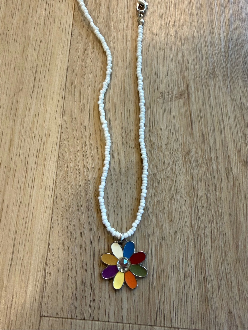 White Beaded Necklace with Rainbow Flower Pendant